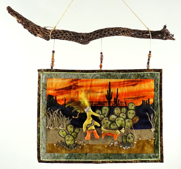 Sonoran desert sunset inspired textile art work on cholla branch